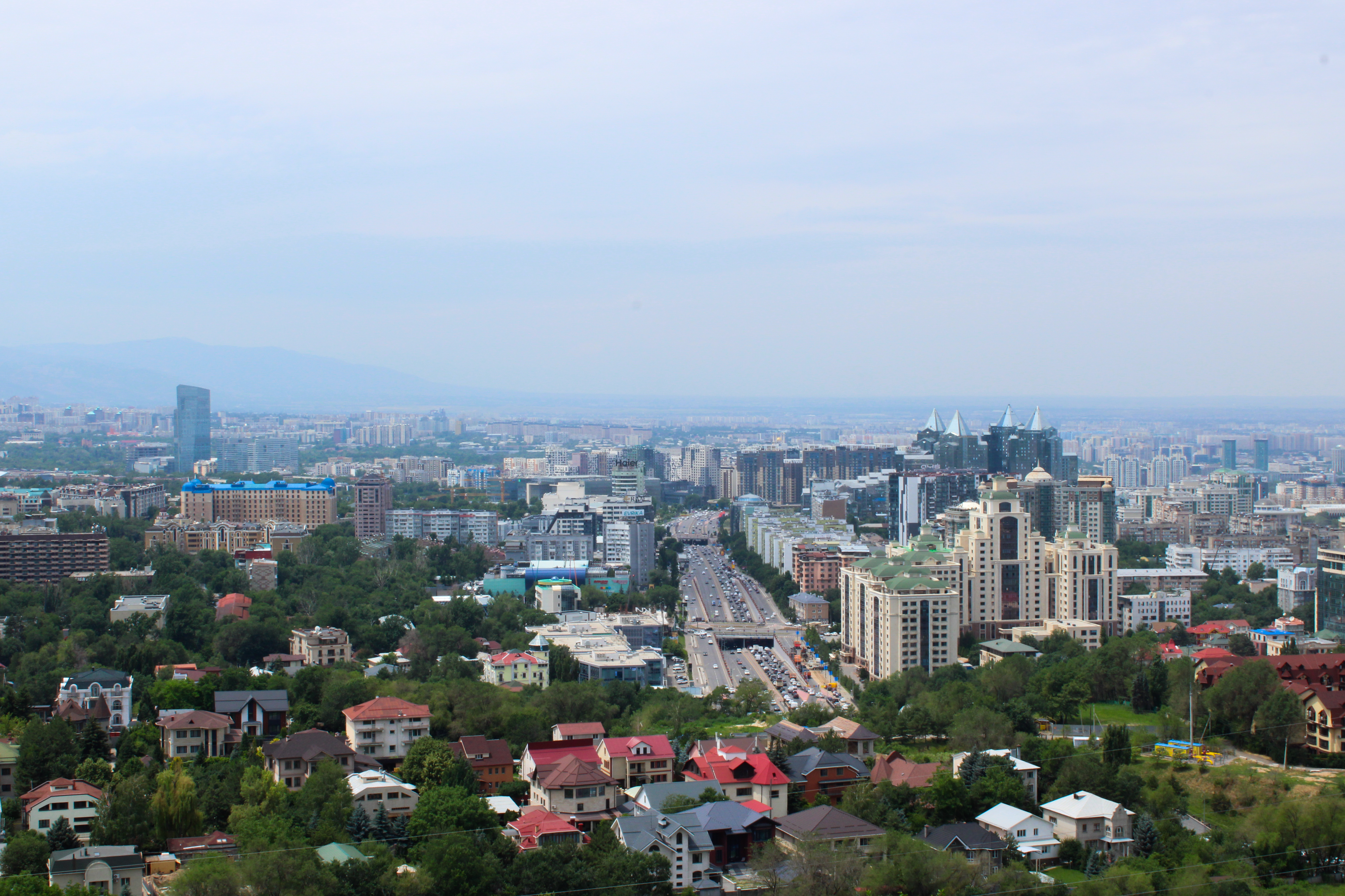 Almaty cityscape with mountains rising in the background