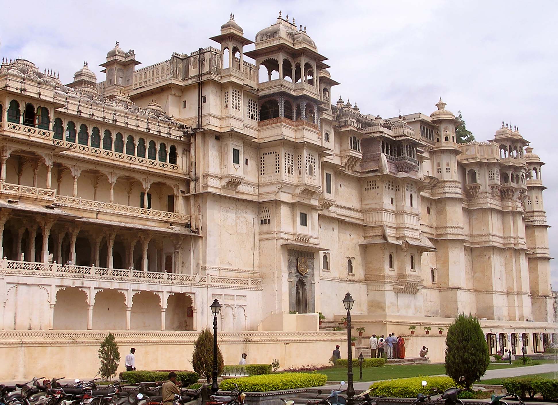 Ornate facade and domed towers of the City Palace in Udaipur, India