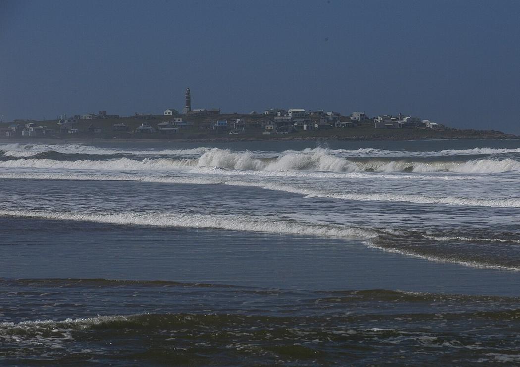 The salty breeze carries sea lion calls across the sand dunes near the lighthouse on Cabo Polonio's northern beach.