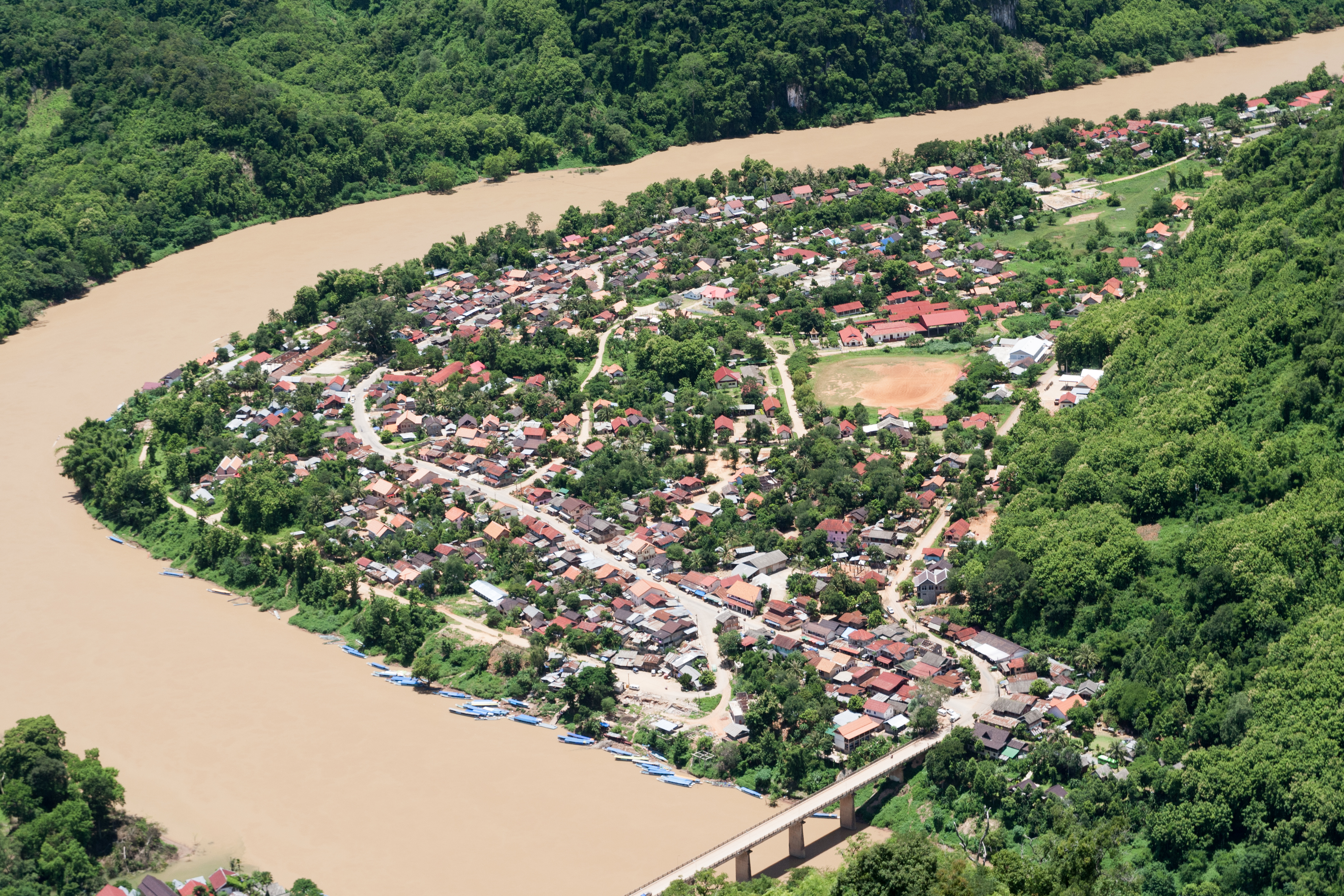 Aerial view of Nong Khiaw village on the Nam Ou river, surrounded by limestone karsts