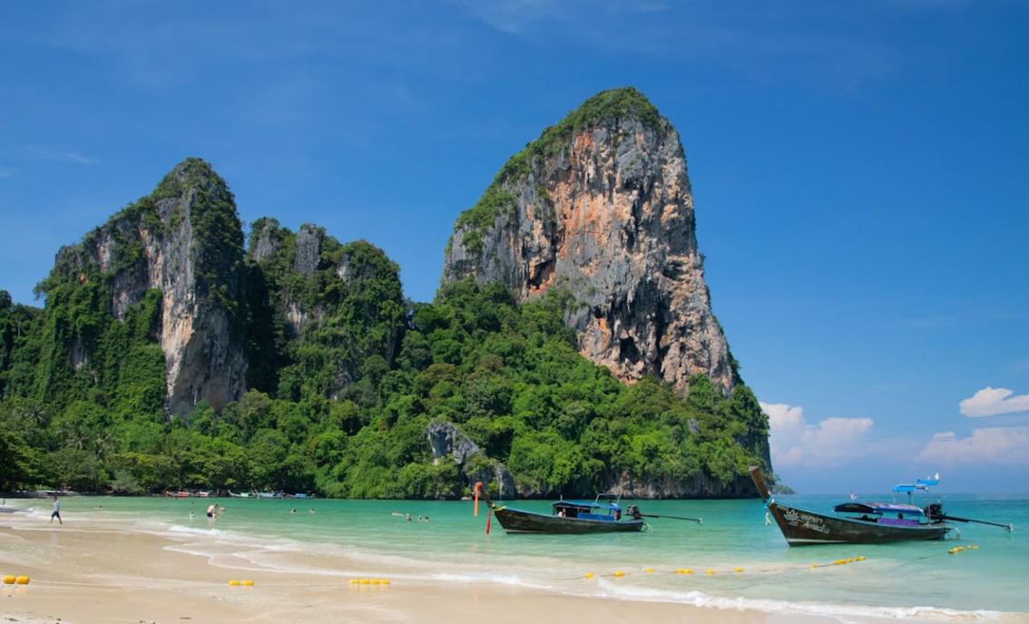 Experience Thailand's Vibrant Culture from Bangkok to Koh Phangan 12 Thailand temple bangkok Landscape photo of Railay Beach Thailand with Longboats in the foreground 3
